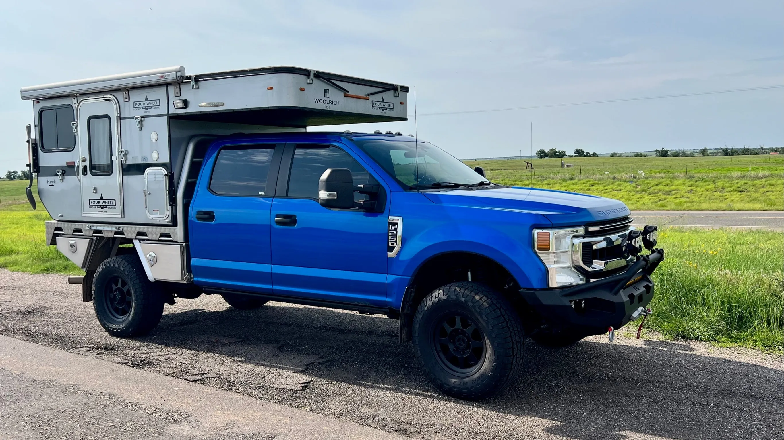 Customer Classified: 2020 Ford F250 and Woolrich Hawk Flatbed Four Wheel Camper Combo