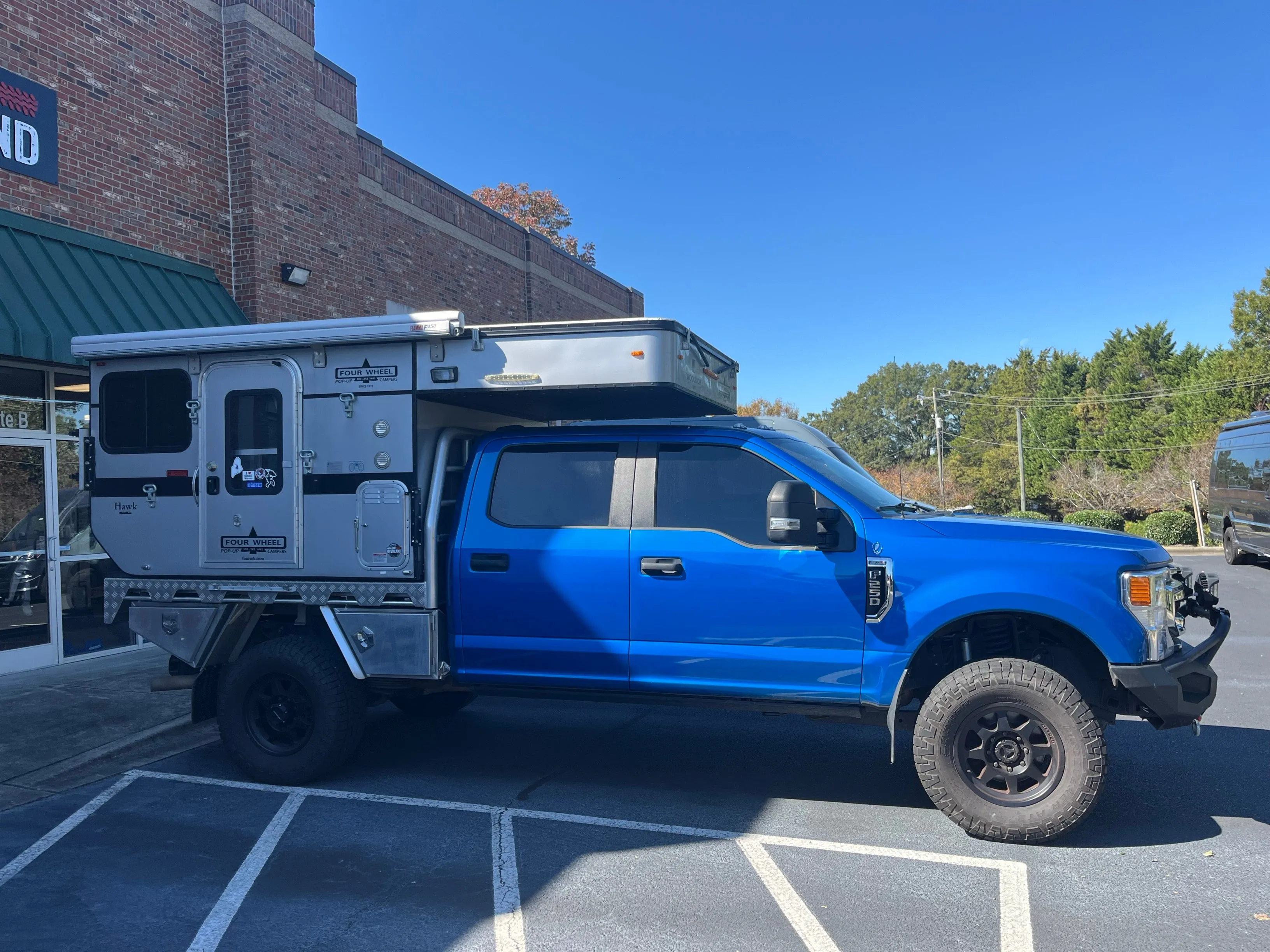 Customer Classified: 2020 Ford F250 and Woolrich Hawk Flatbed Four Wheel Camper Combo