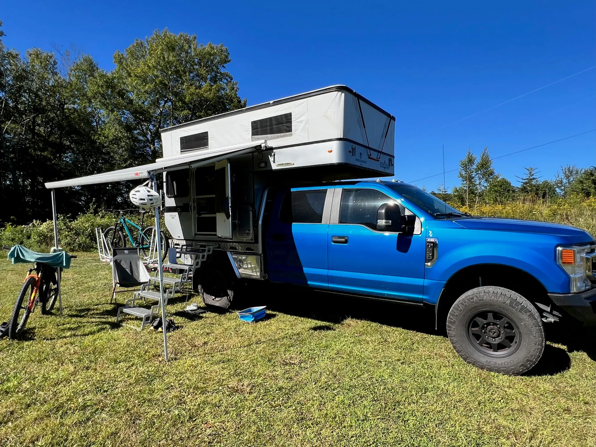 Customer Classified: 2020 Ford F250 and Woolrich Hawk Flatbed Four Wheel Camper Combo