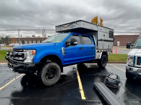 Customer Classified: 2020 Ford F250 and Woolrich Hawk Flatbed Four Wheel Camper Combo