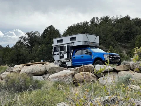 Customer Classified: 2020 Ford F250 and Woolrich Hawk Flatbed Four Wheel Camper Combo