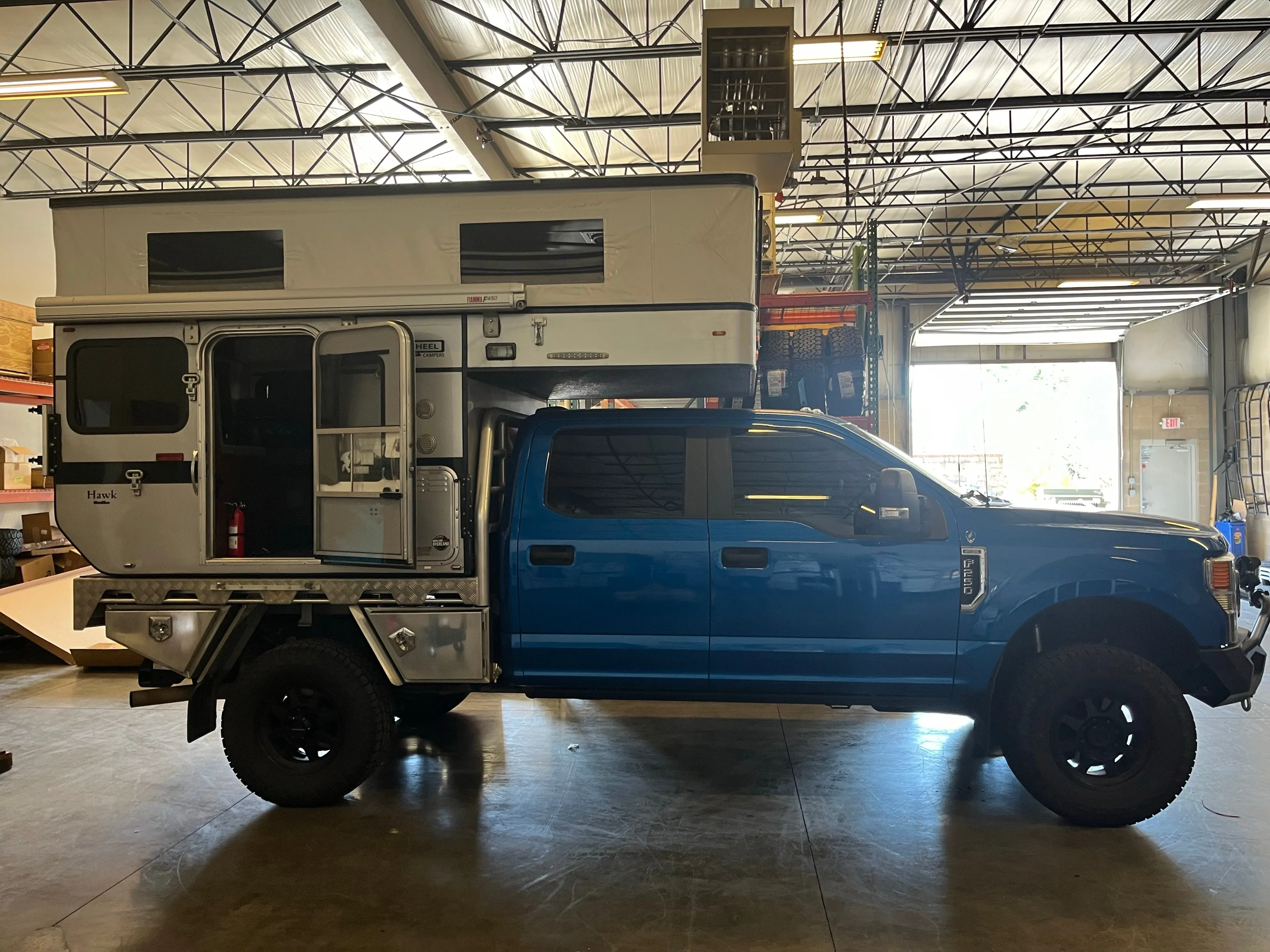 Customer Classified: 2020 Ford F250 and Woolrich Hawk Flatbed Four Wheel Camper Combo